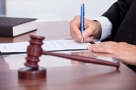 A judge signing the final divorce decree on an uncontested divorce