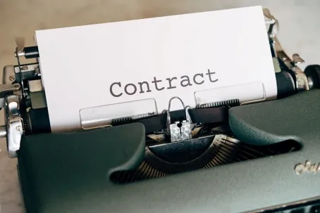 A piece of paper with a contract stamp on it.