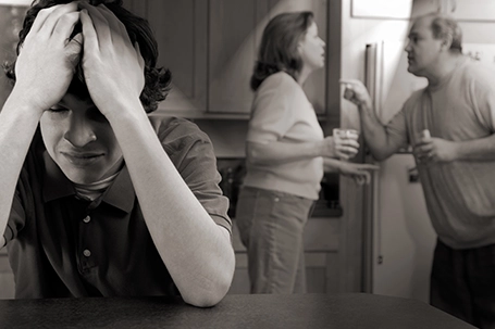 Son cries as parents fight.