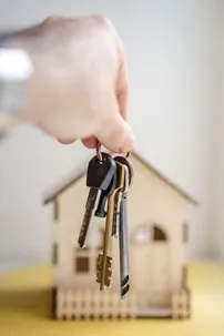 A model house with a bunch of keys.