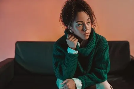 A woman sitting and feeling lonely