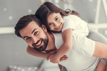 A joyful image of a father and his daughter