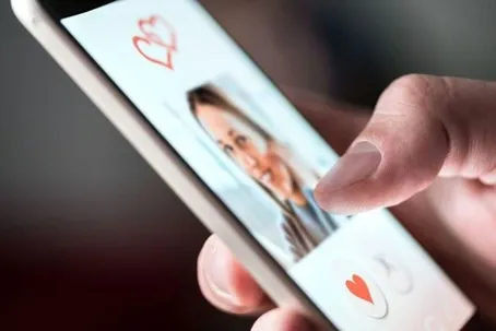 An image of a woman using or appearing on a dating app.