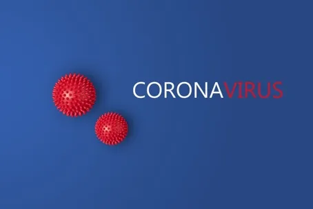 The words “coronavirus” on a blue background with two red spheres.