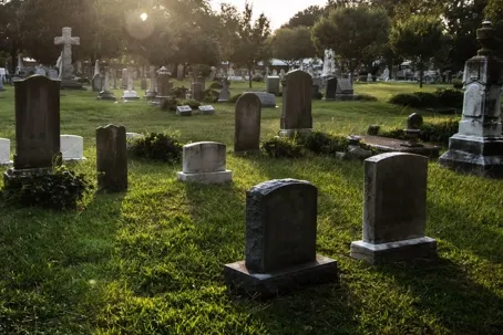 An image of a cemetery during sunset.
